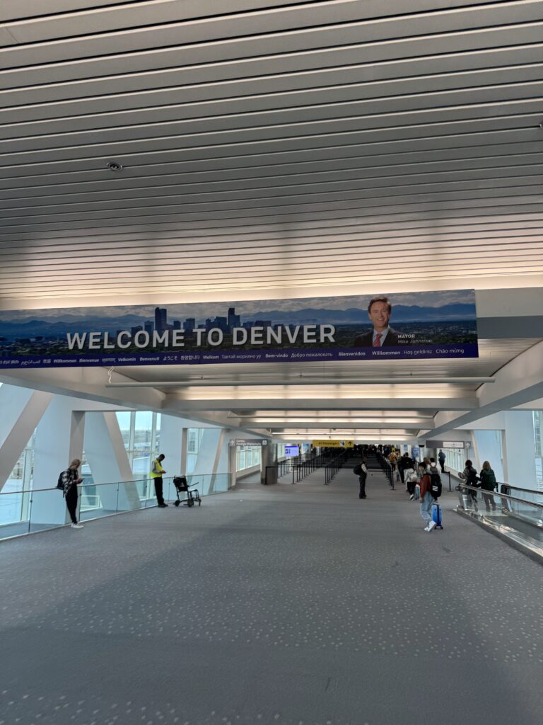 Welcome to Denver sign at DIA