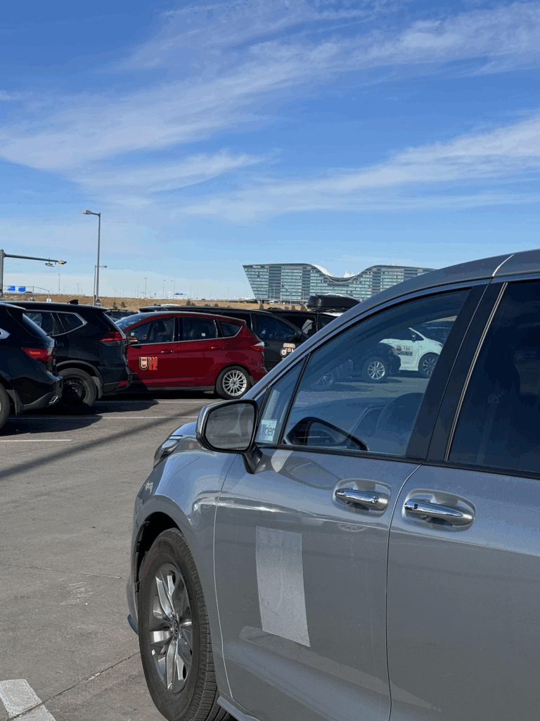 taxi cab and rideshare cars at Denver Airport staging lot